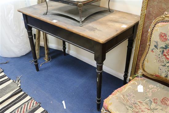 A Heal & Sons pine top ebonised side table 3ft 6in.